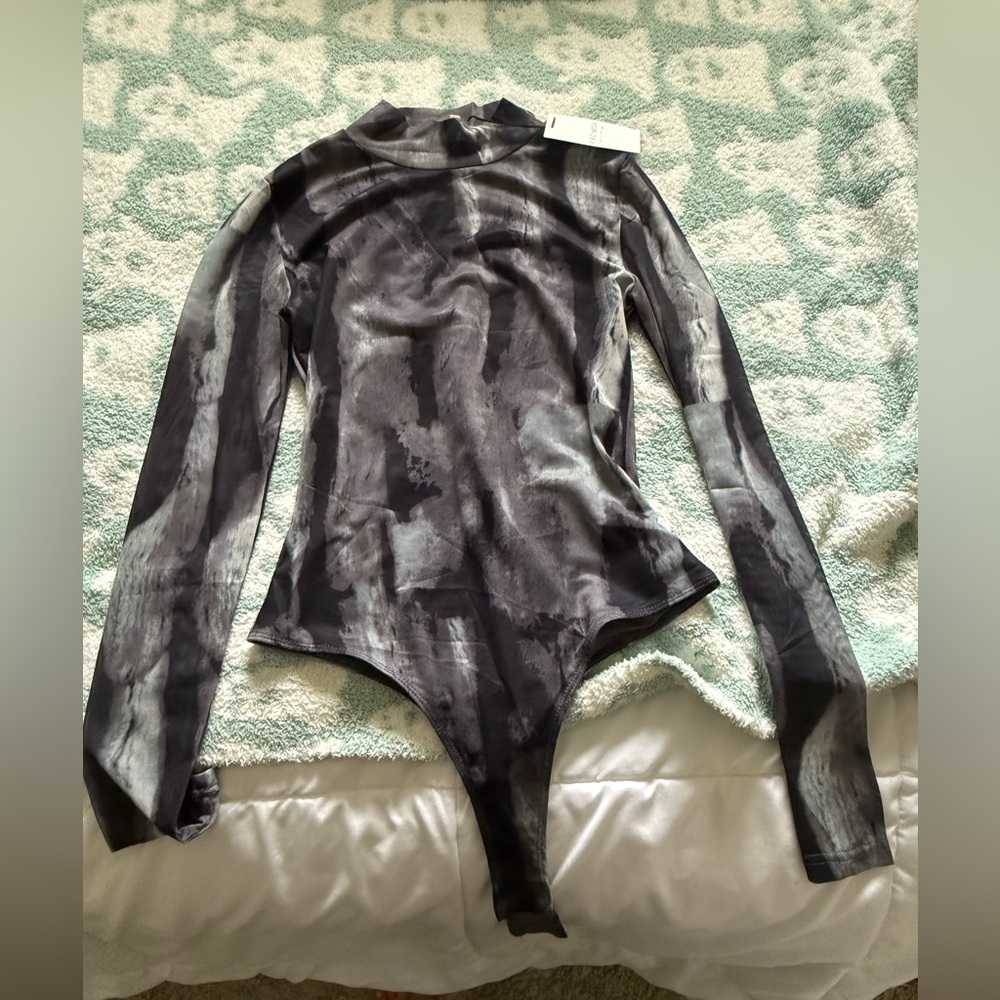 Marble see through body suit!!
Never worn
Brand new with tag